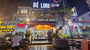 Mặt tiền khang trang, nổi bật với khuôn viên cây xanh và hệ thống ánh sáng lung linh tại Dê Linh Đan Cơ Sở 4.